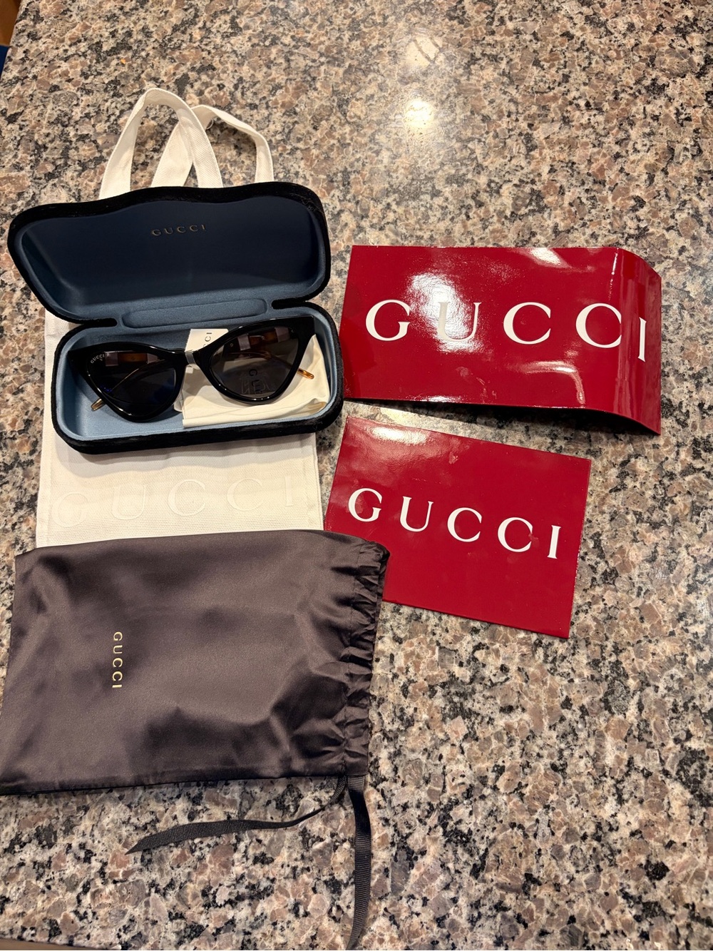 Gucci Black Cat-Eye Sunglasses with Gold Accents